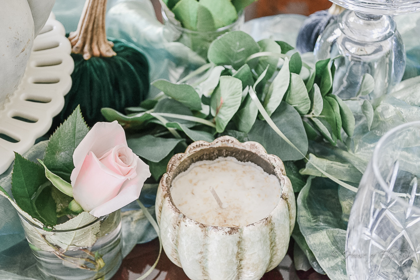 Green candle and pink rose