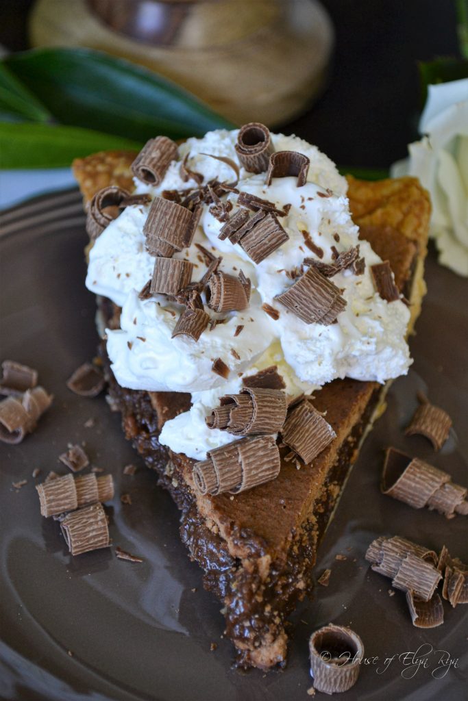 chocolate chess pie with whipped cream and chocolate curls