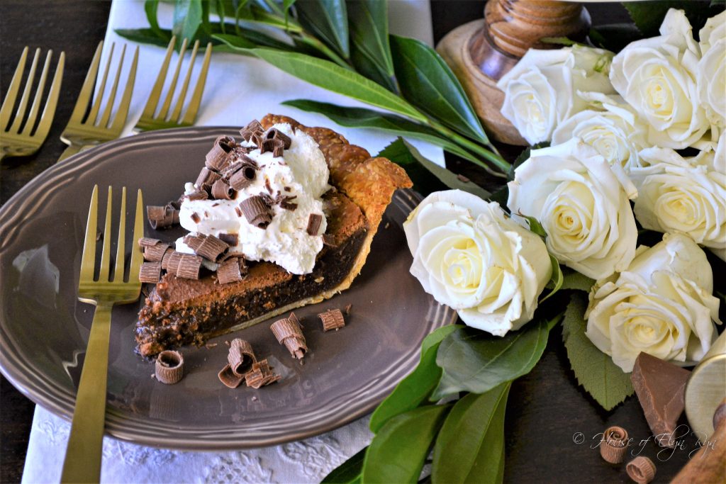 chocolate chess pie with whipped cream and chocolate curls