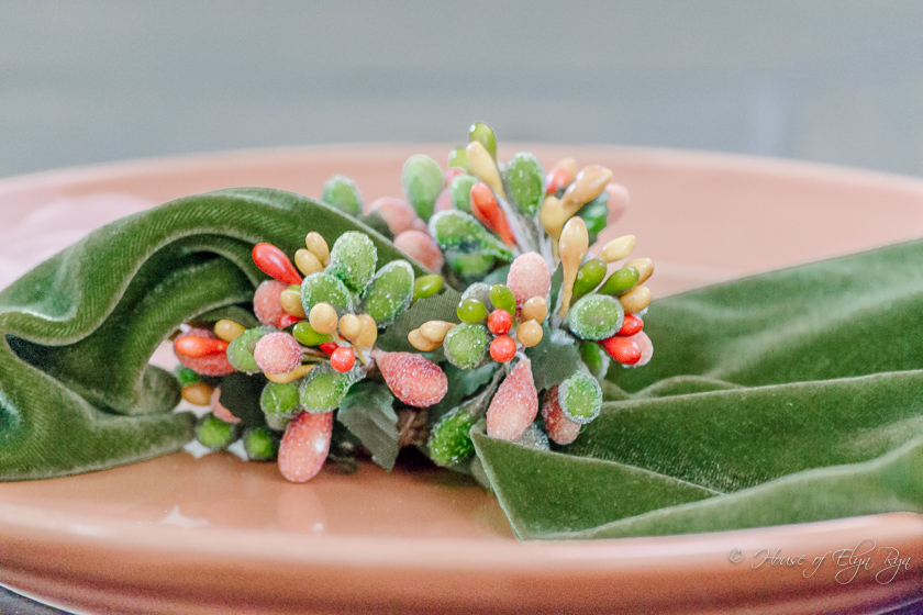 Velvet napkin with napkin ring complementing the floral arrangement