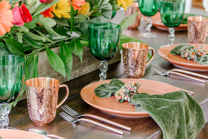 Place setting with green goblet and copper mug