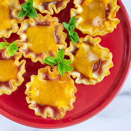 Phyllo cups appetizer with sour cherries and cheese
