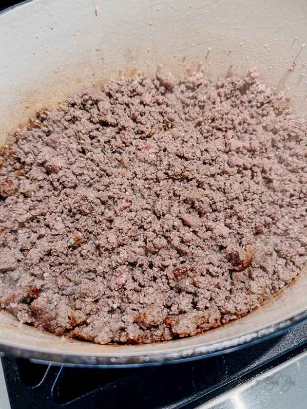 Browned ground beef.