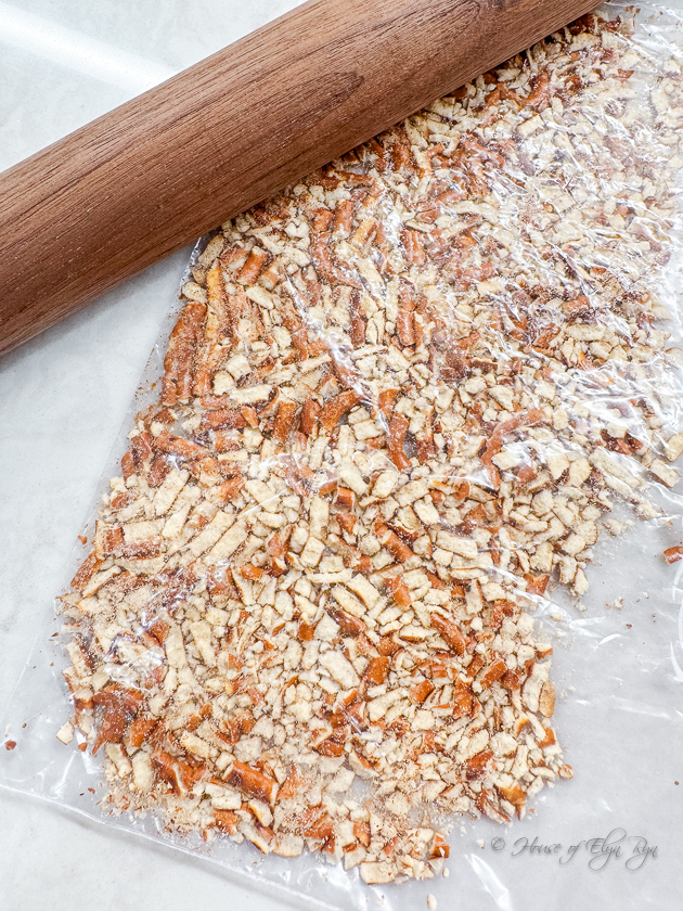Break up pretzels and graham crackers with a rolling pin and a resealable plastic bag.
